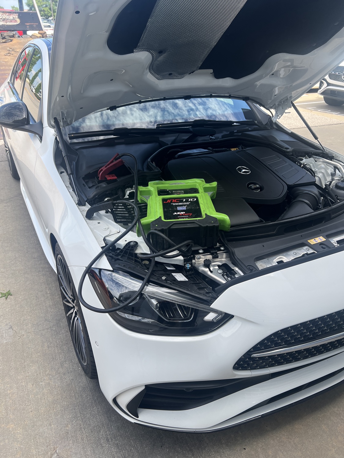 Sawa Towing technician performing a jump-start on a vehicle