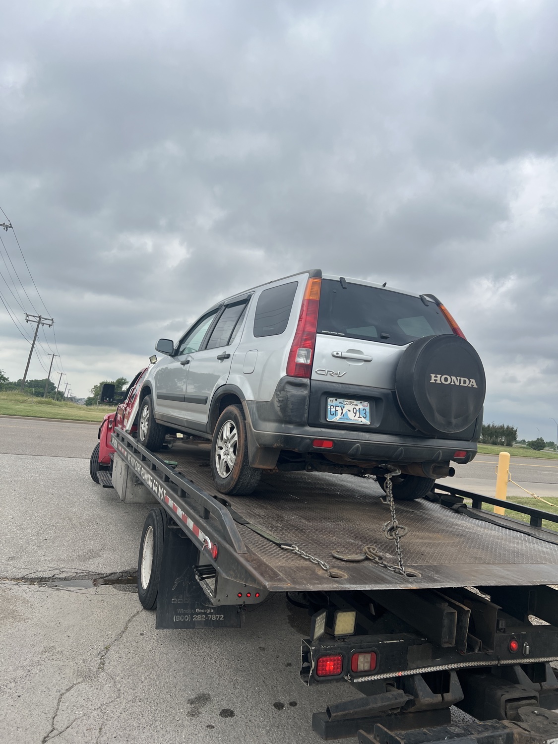 Vehicle loaded on a Sawa Towing flatbed after roadside service